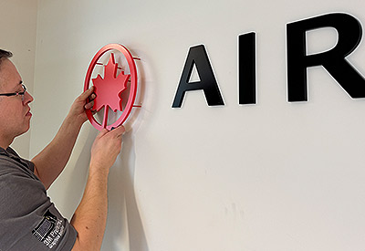 Installation of signage for Air Canada